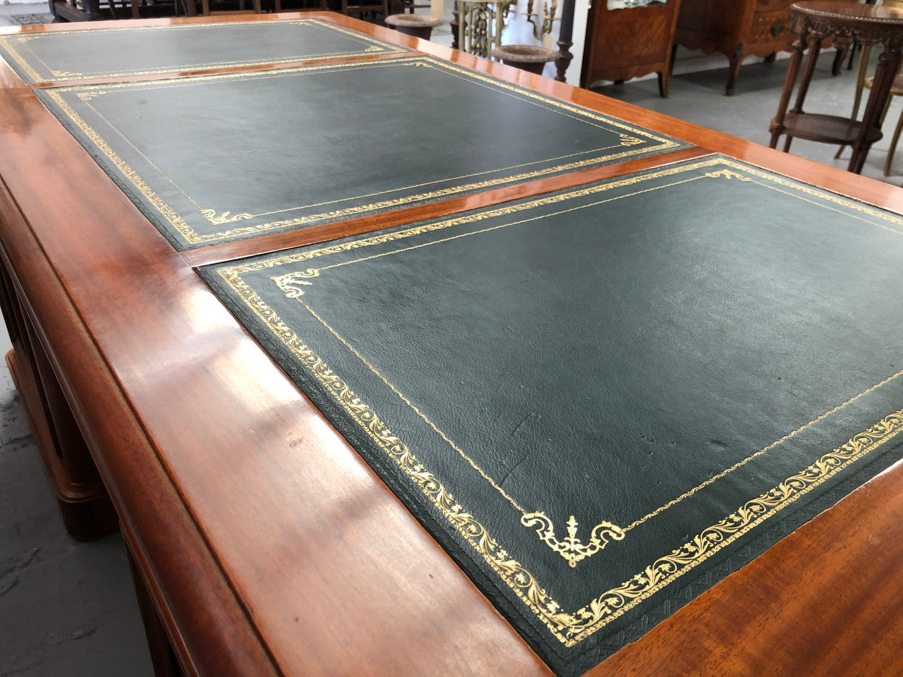 Antique French Mahogany and leather inset top double pedestal partners desk. Plenty of storage space with 9 long drawers on one side and space for someone to sit on the other side. In good restored condition. Circa 1880's.