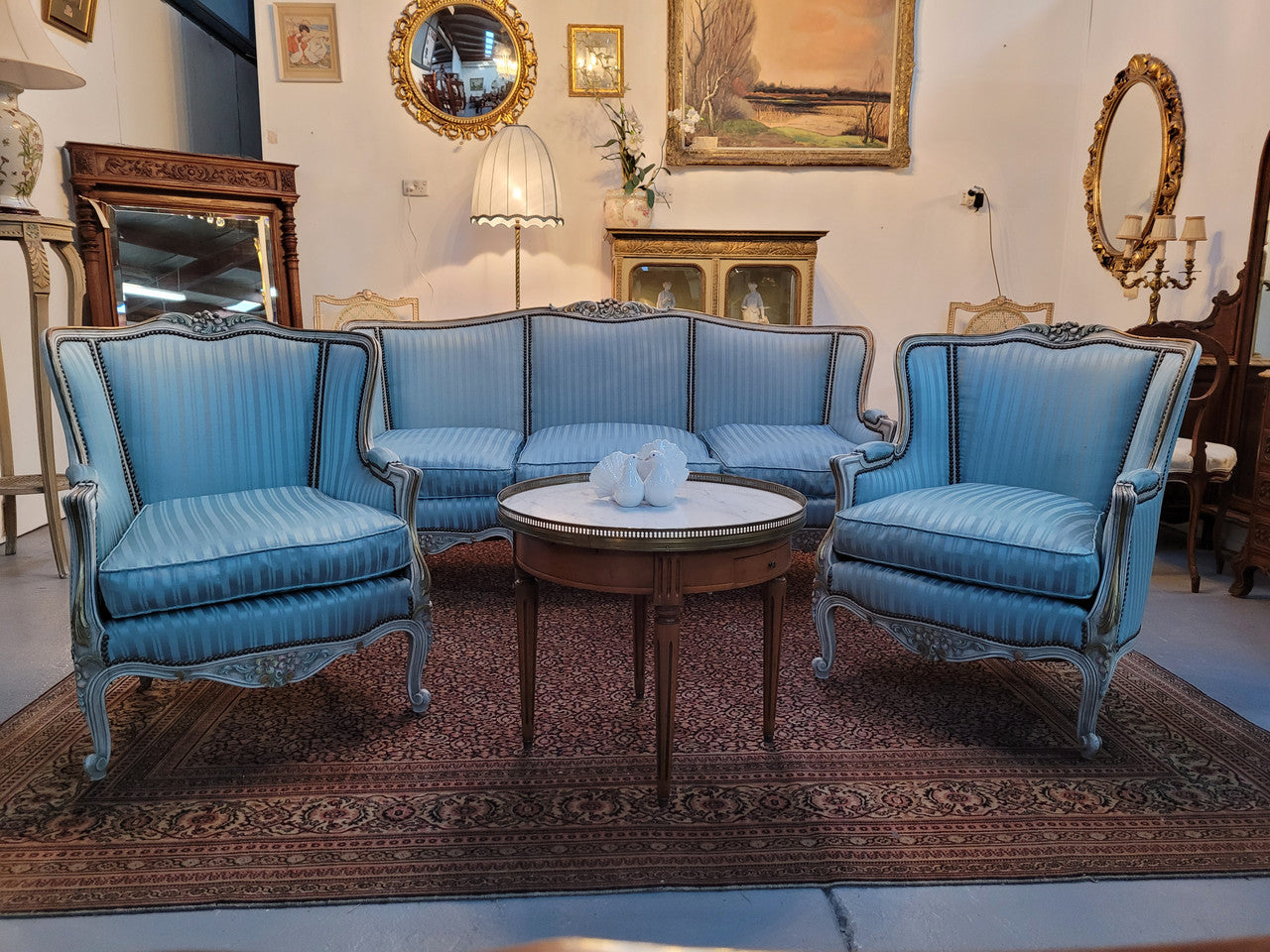 Well Proportioned Louis XV Salon Suite consisting of well proportioned 3 seater down cushioned, winged settee with 2 matching bergere chairs. All upholstered in stunning blue self stripe fabric. In excellent condition. Circa: 1930's.