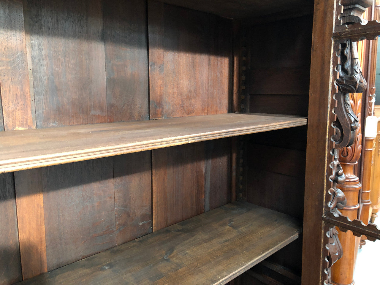 Amazing dark Oak heavily carved Gothic style bookcase with lovely details and adjustable shelves in good original detailed condition. The doors currently have no glass which can easily be added or be left with open shelves.
