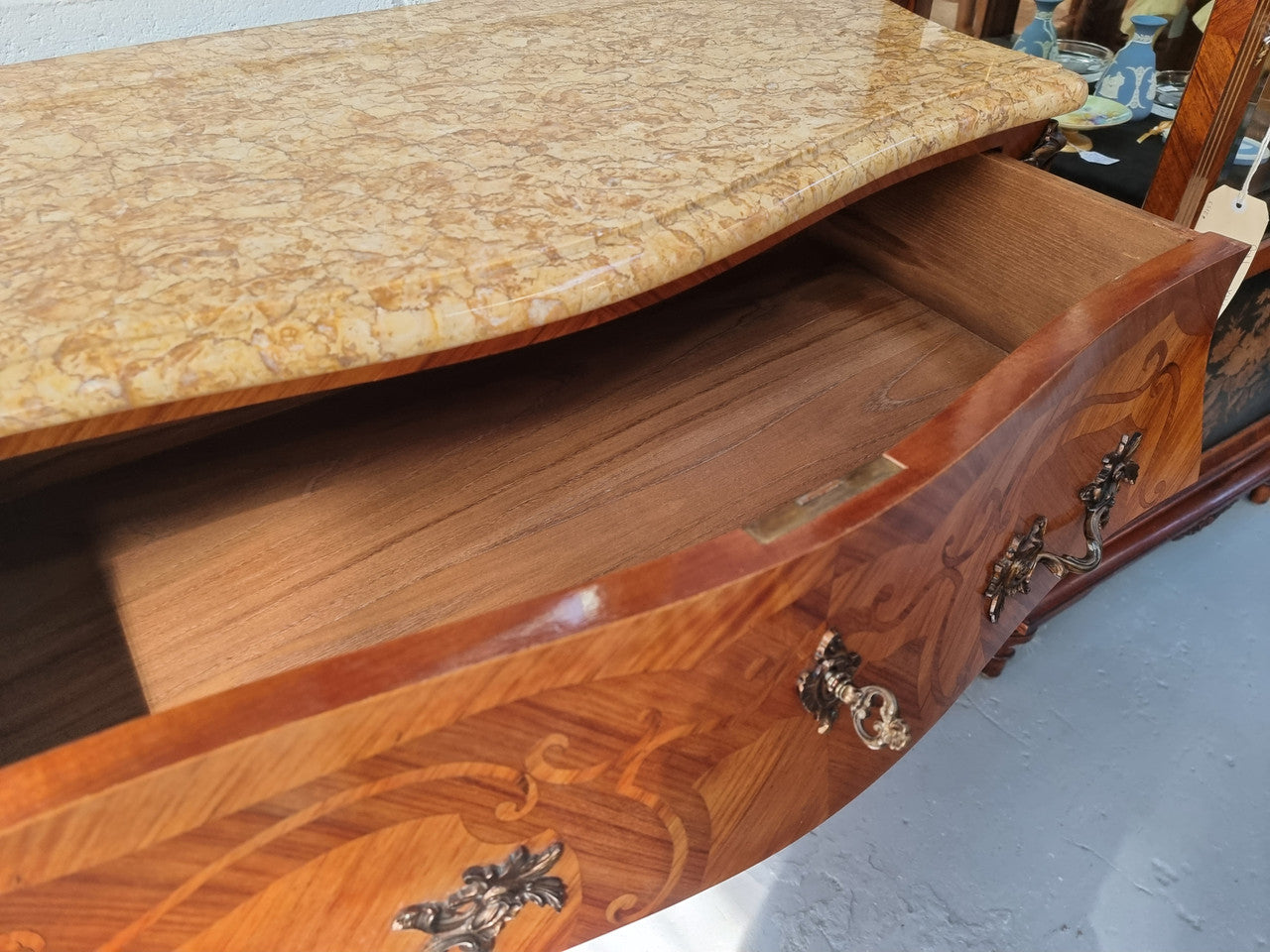 French marquetry inlaid Kingwood marble top commode. It has two drawers and beautiful mounts. Is in good original detailed condition.