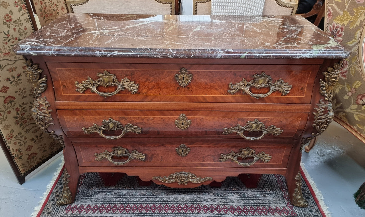 French Louis XVI style three drawer commode with amazing coloured marble. It has decorative brass mounts and is in very good original detailed condition.