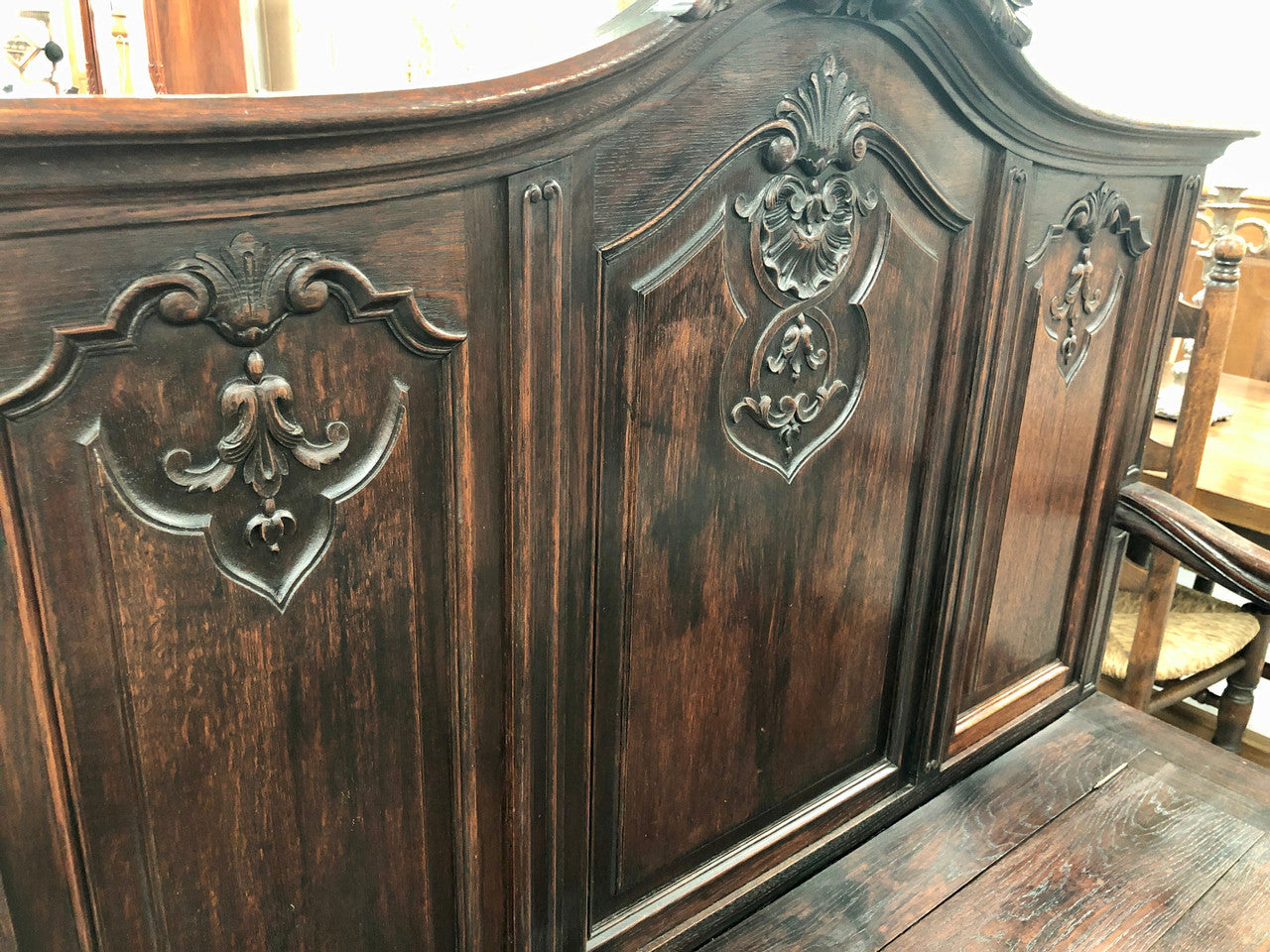 Beautifully carved French Oak hall seat with a lift up lid and storage space inside. In good original detailed condition.