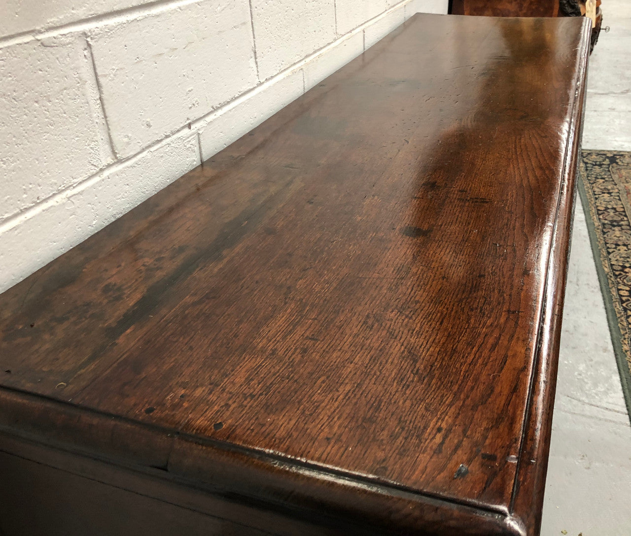 Early 19th Century English Oak dresser base with three large drawers. In very good original detailed condition.