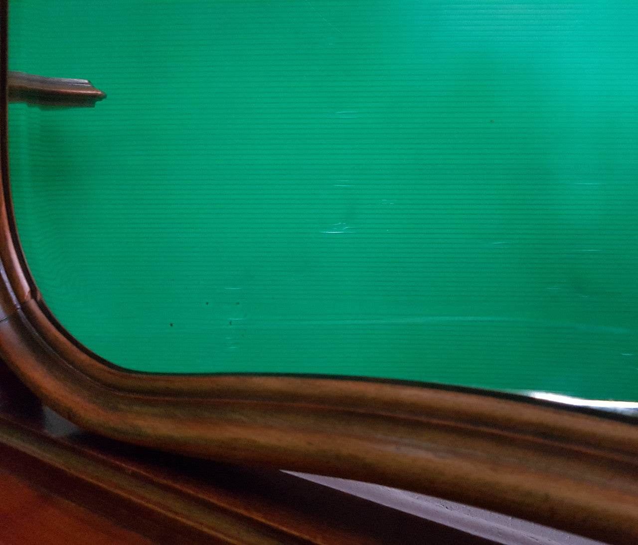 French walnut Antique Louis XV style dressing table of petite size, retaining it's original bevelled edge tilt mirror. In good original condition with three small drawers. Circa 1900.