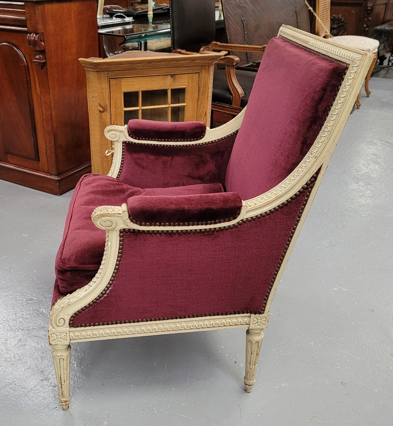 Louis 16th Style high back upholstered chair with maroon velvet fabric, decorative carvings and original paint. It has been sourced from France and in good original condition.