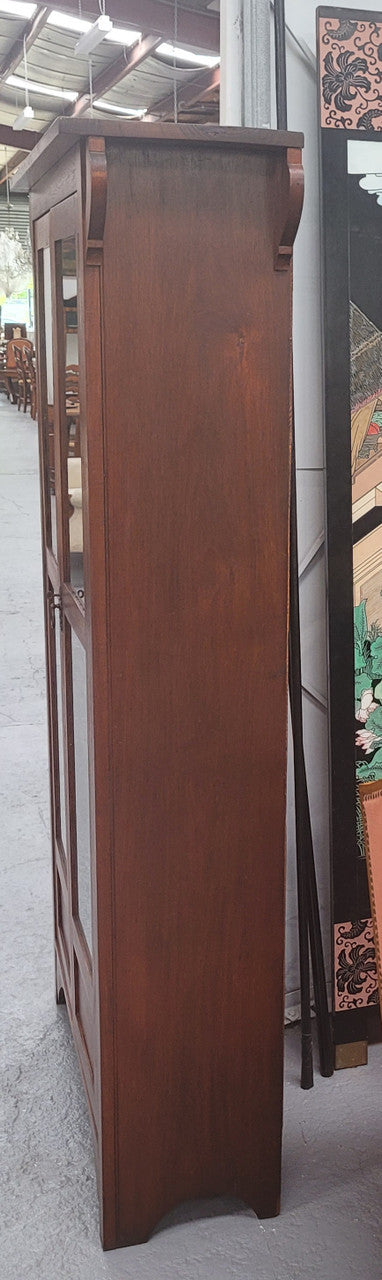 Beautiful two door Blackwood bookcase with glass doors and with four fully adjustable shelves. It is in good original detailed condition.