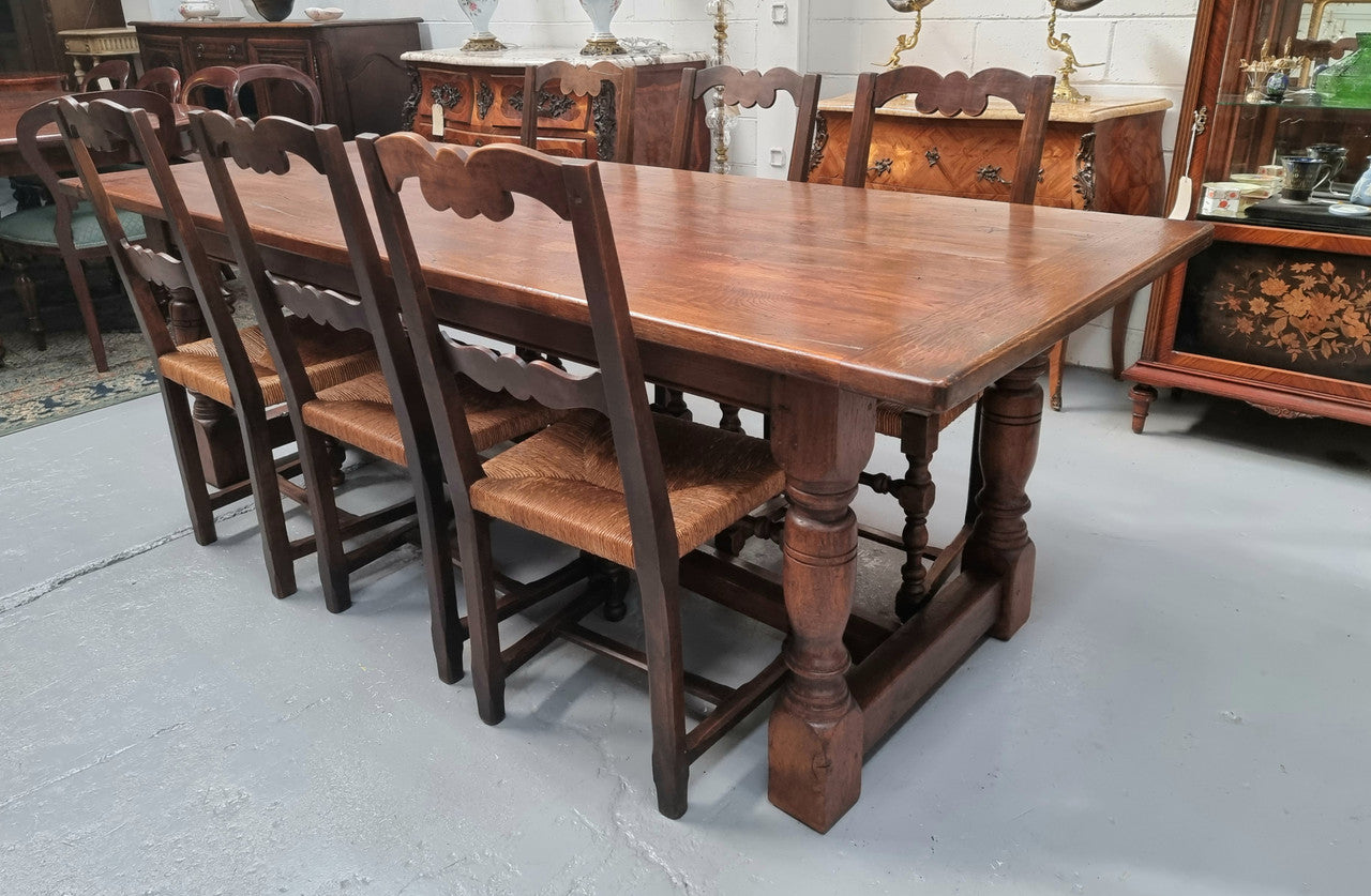 Vintage French Oak stretcher base farmhouse table. It is in good original condition.