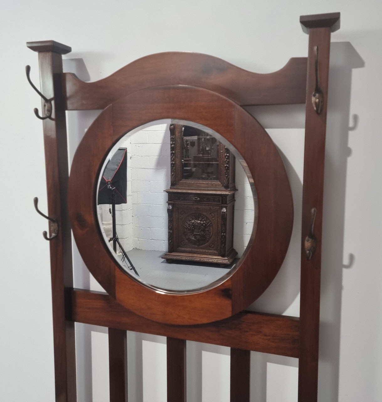 Blackwood Federation hall stand of pleasing narrow proportions. Beautiful round mirror with four lovely hooks and a lift up sit for added storage. In good original condition.