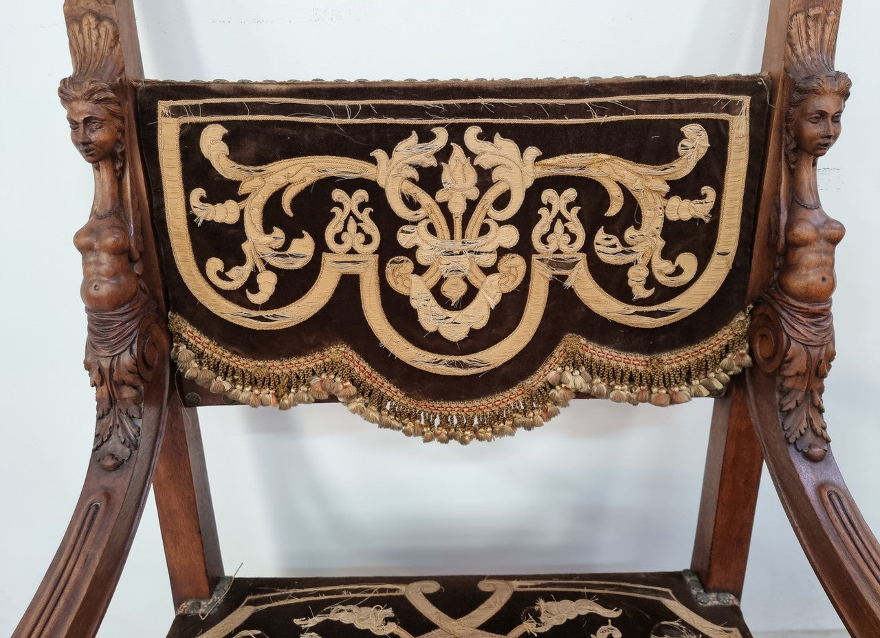 Beautifully carved Walnut Egyptian Revival armchair with amazing hand sewn Stumpwork embroidery coverings. In good original detailed condition.