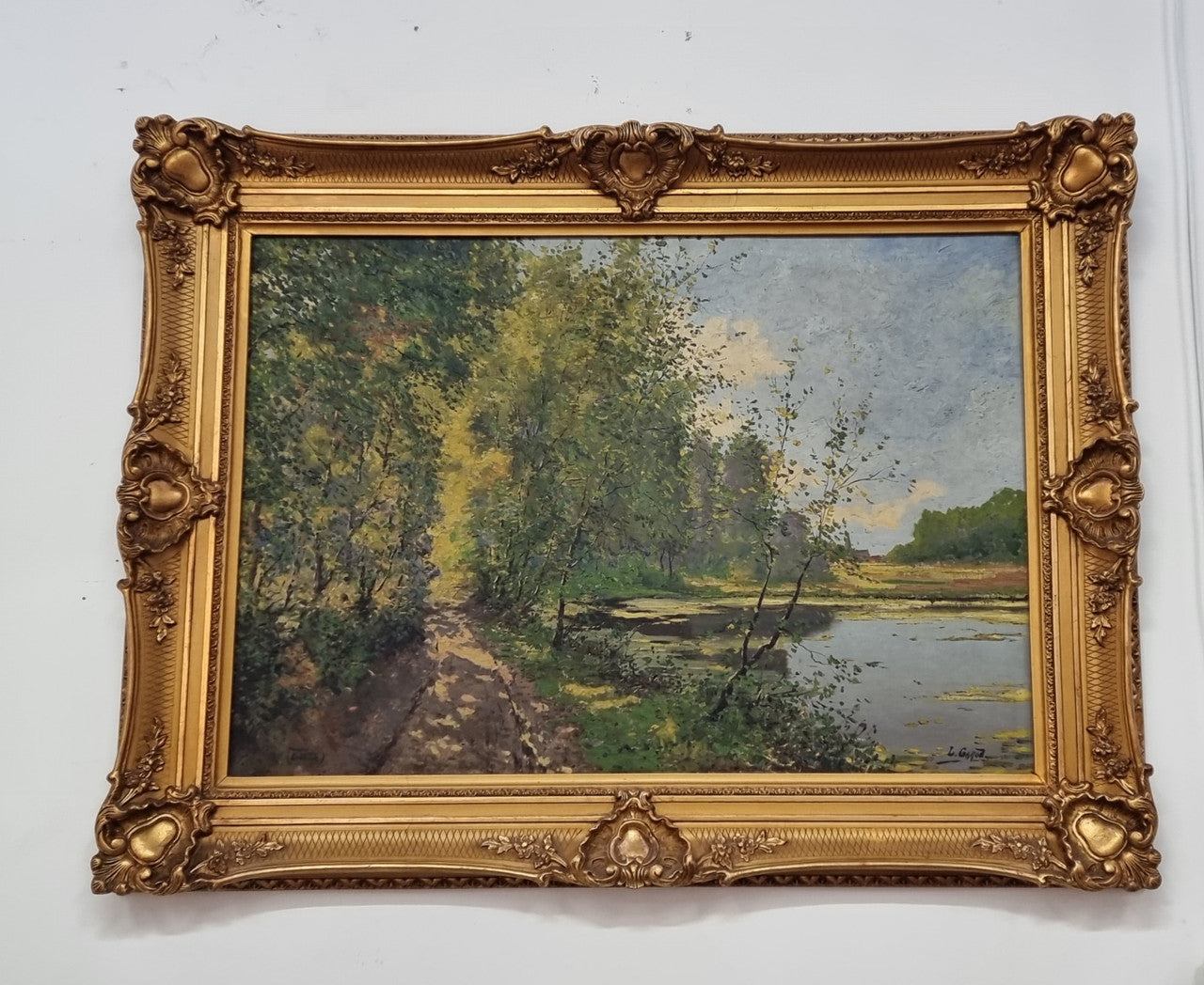 Sourced in France is this beautiful impressionist oil on canvas by "LOUIS GAROT". In a lovely ornate frame, signed and in good original condition.
