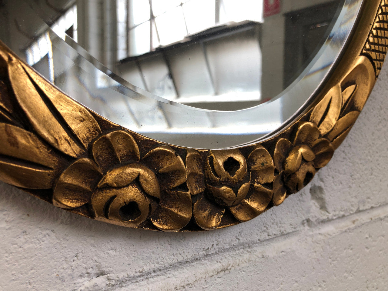 Beautiful French decorative Art Deco giltwood wall mirror with lovely floral detail. Contains its original mirror and is in good original condition.