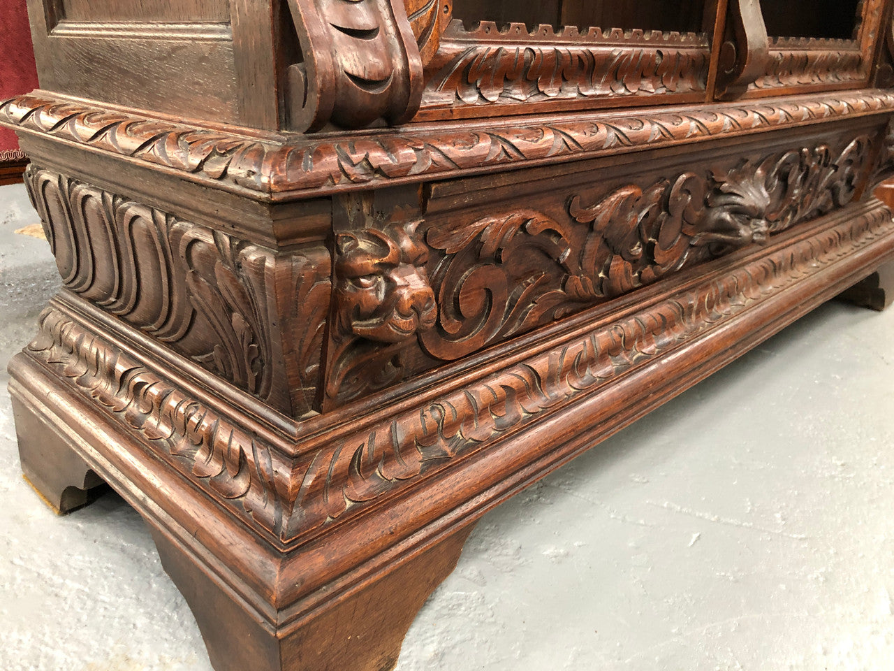 Amazing dark Oak heavily carved Gothic style bookcase with lovely details and adjustable shelves in good original detailed condition. The doors currently have no glass which can easily be added or be left with open shelves.
