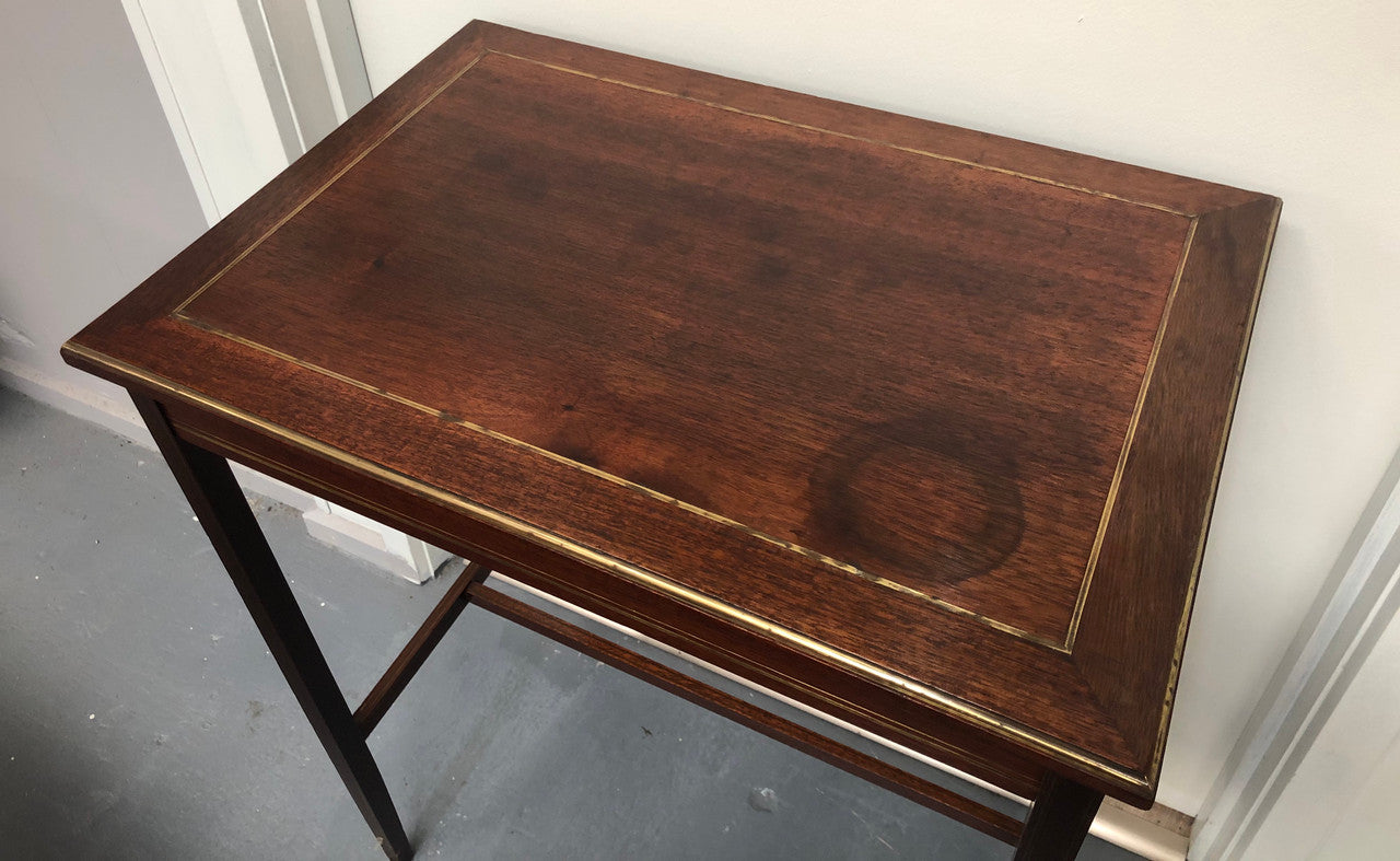 Elegant rectangular mahogany French brass inlaid occasional table. Is in good original condition.