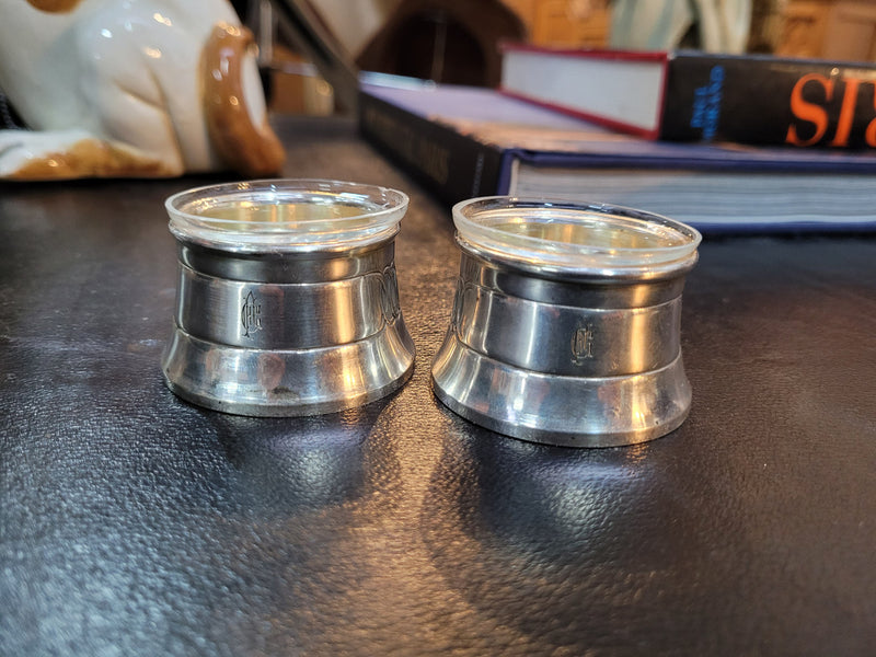 Pair antique silver salt cellars with liners. Stamped “800” 80g. 4.5cm Diam & 3cm Height. In good condition please view photos as they help form part of the description.