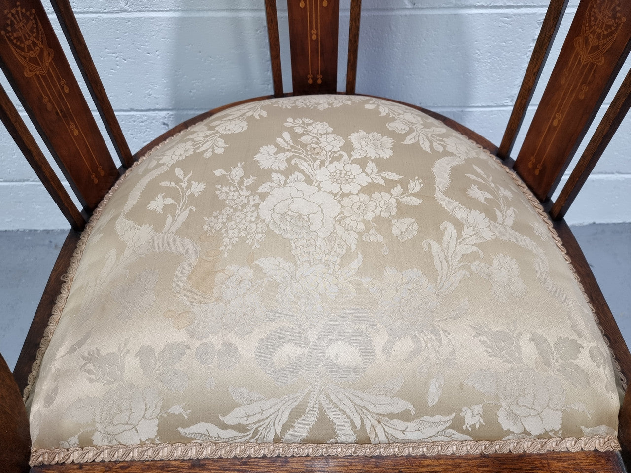 Charming Edwardian inlaid walnut upholstered armchair. In good original condition.