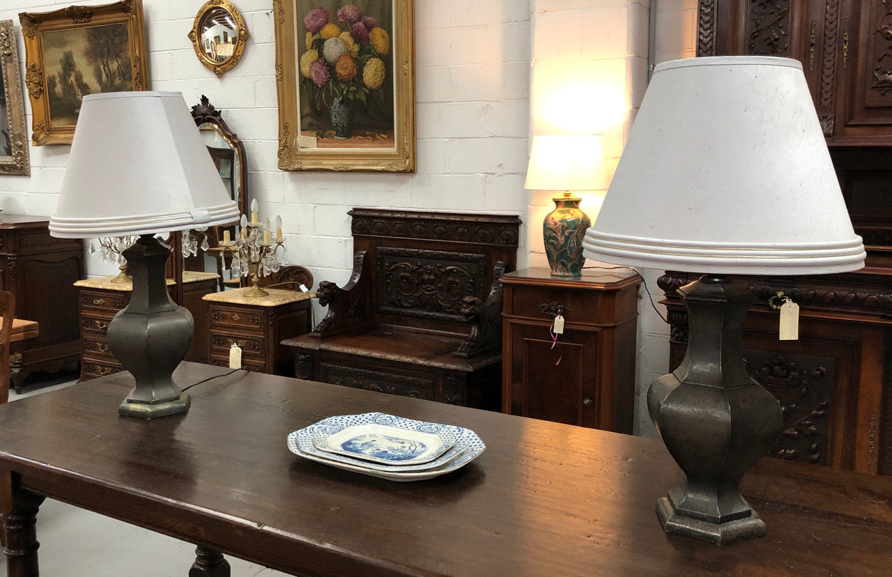 Beautiful pair of 19th Century pewter covered Bronze table lamps with light grey shades .They have been rewired and in good working order.