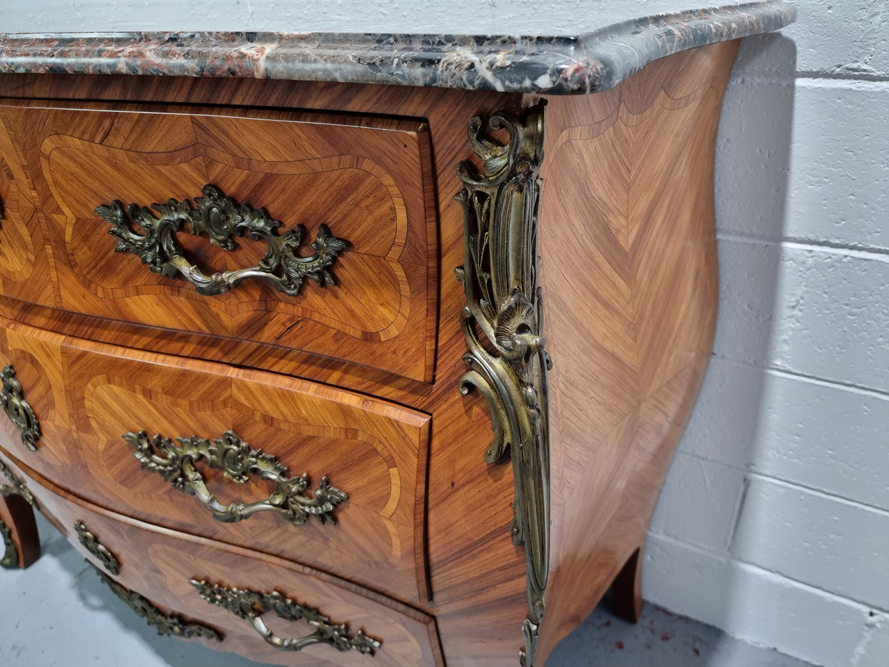 Attractive French marble top Louis XV style three drawer commode with decorative ormolu mounts. In good original detailed condition.