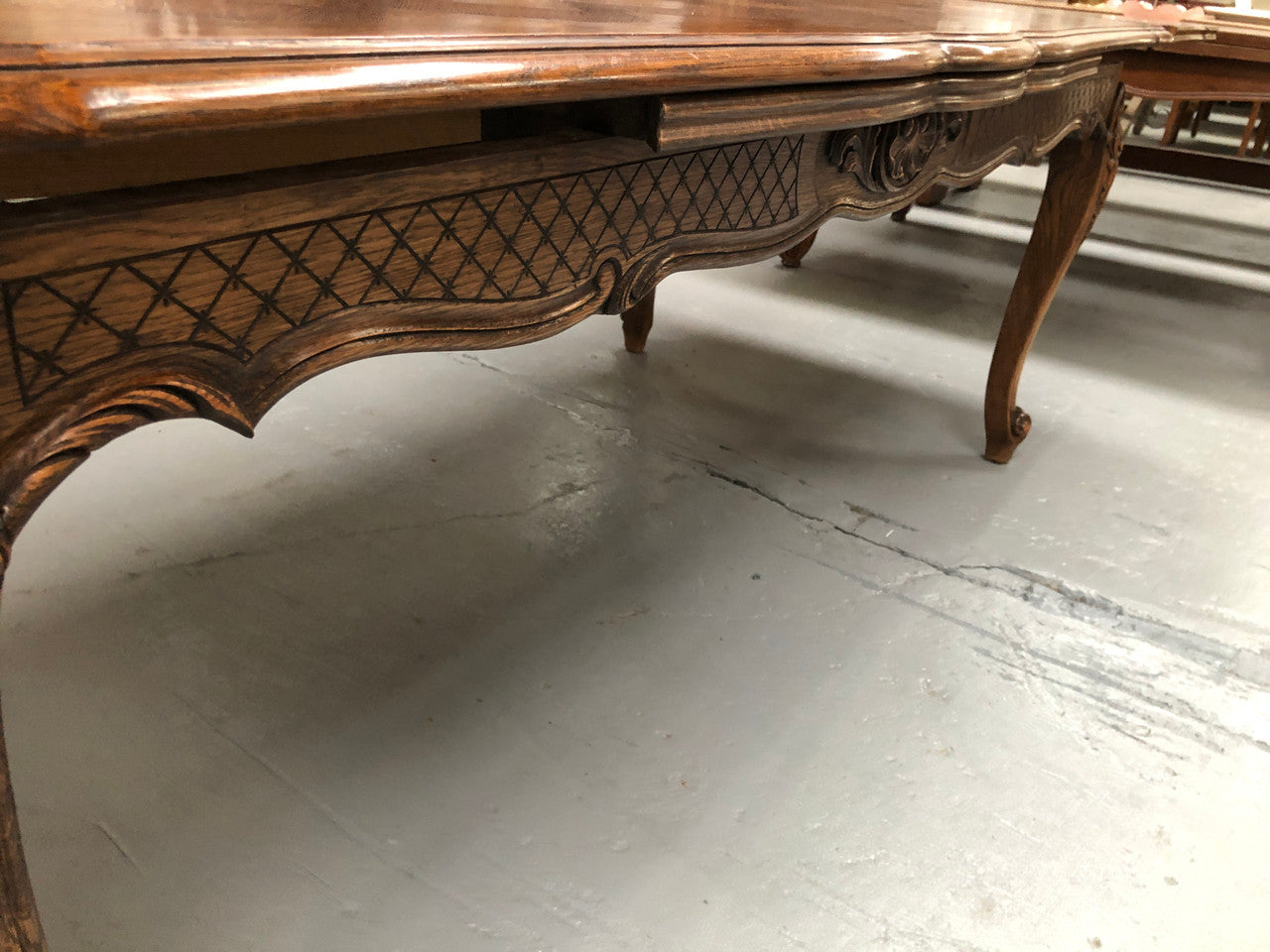 High quality French Oak Louis XV Style, beautifully carved extension table. It has an amazing parquetry top and when fully extended measures to 3 meters long. In very good original detailed condition.