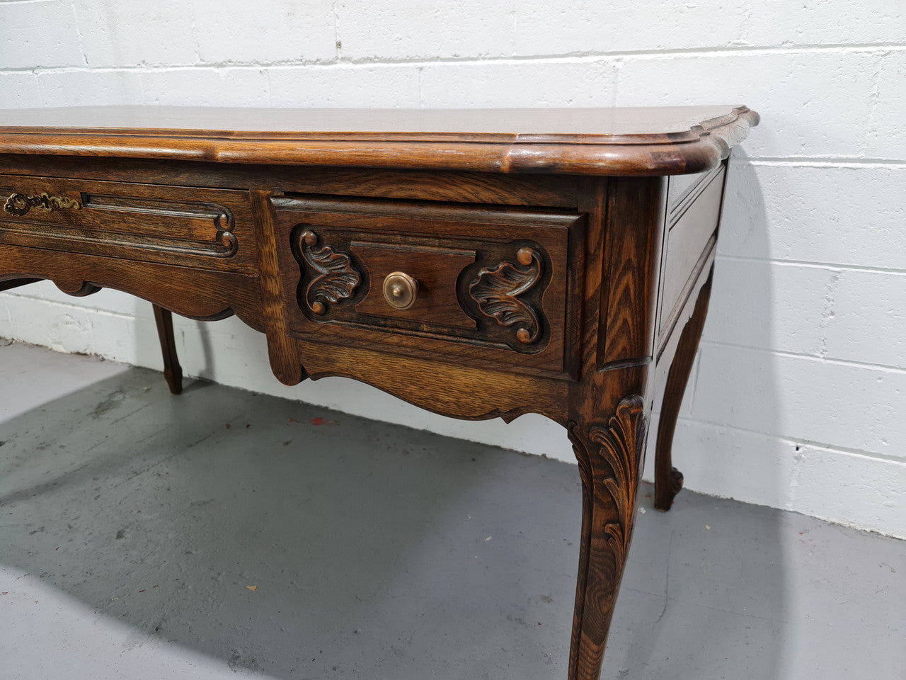 Attractive large Louis XV style Oak faux partners desk. Nicely carved details with three large functioning drawers, and three faux drawers at the back. In good original detailed condition.