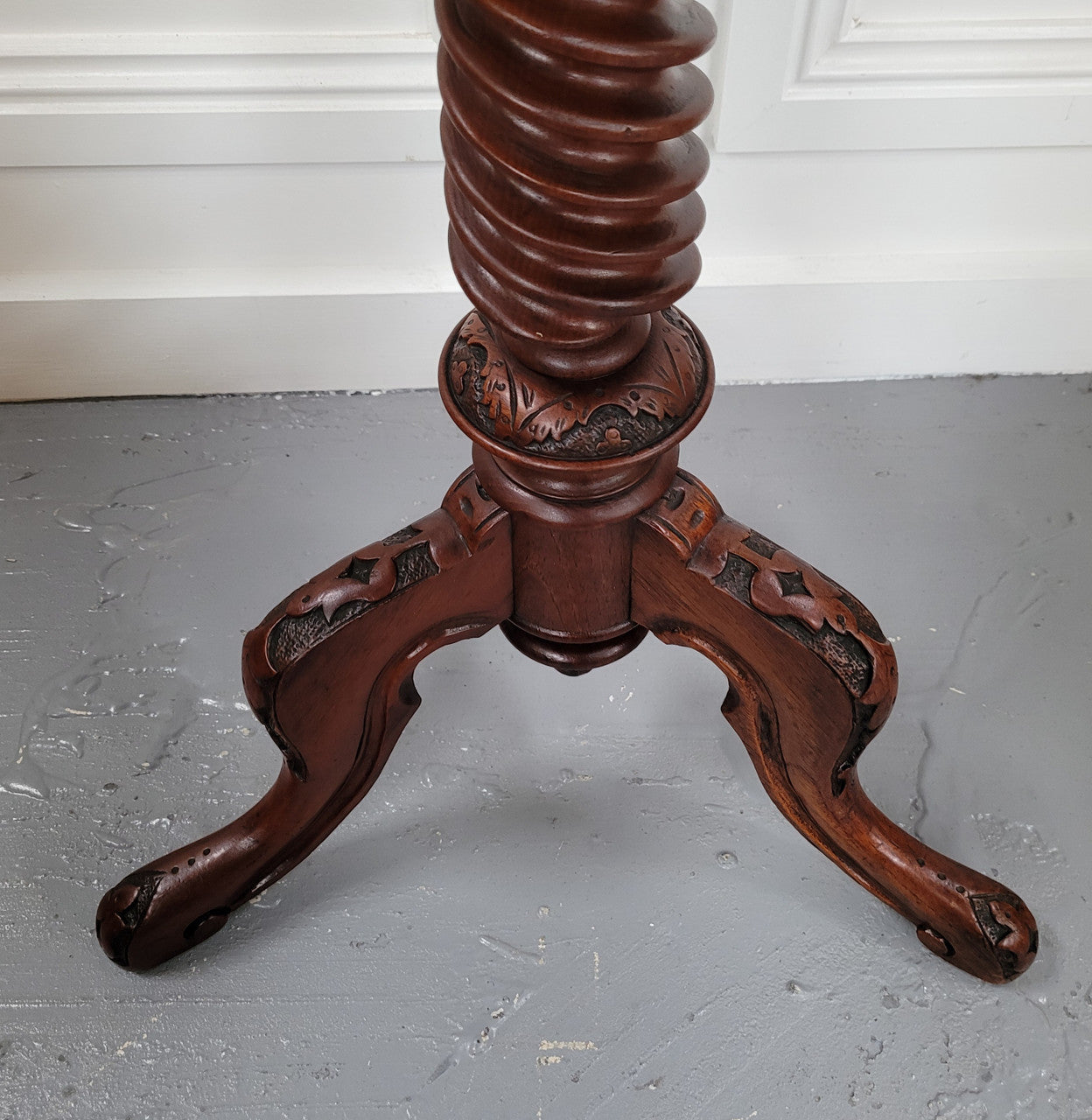 Rare early Victorian Irish Burr Walnut wine table. It has a beautiful carvings and a stunning burr walnut top, on a barley twist column and three shaped legs. It has been sourced locally and is in good original detailed condition. We also have a second table being sold separately which when together make a matched pair.