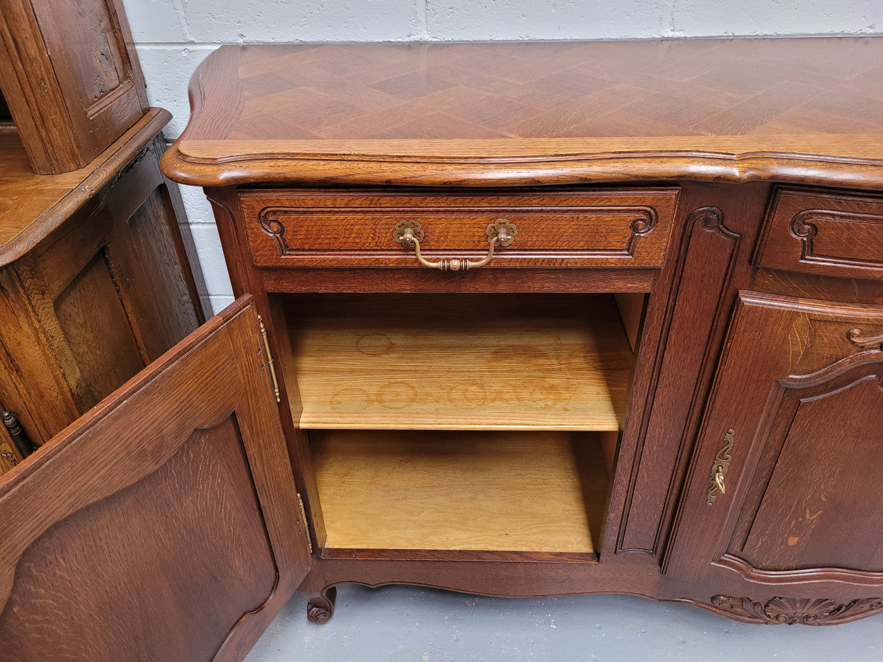 French Oak Louis XV style three drawer three door parquetry top sideboard. It has been sourced from France and is in good original detailed condition.