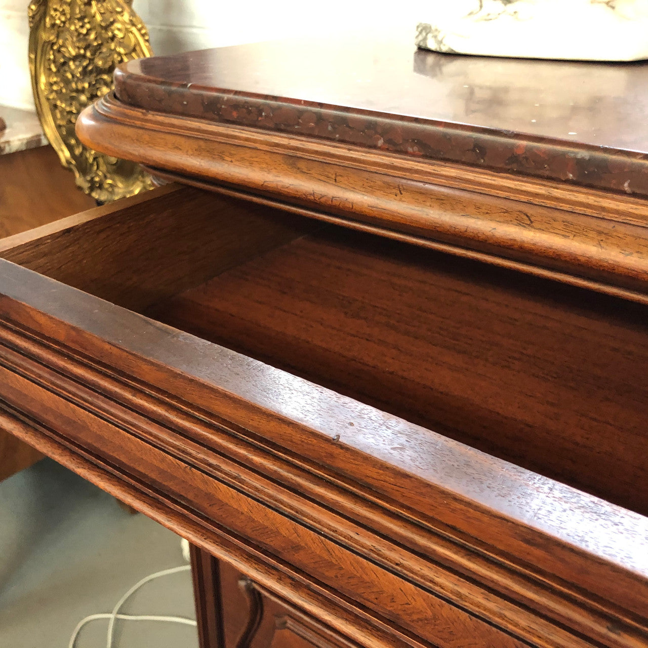 19th Century French Walnut five-drawer marble top commode. In good original detailed condition.
