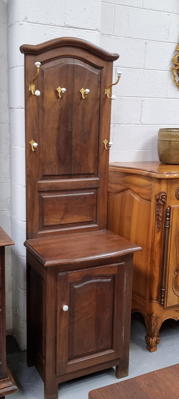 Lovely entrance piece with shelf and single door cupboard, topped with a section for hanging jackets, hats etc. Sourced from France and in good original detailed condition.