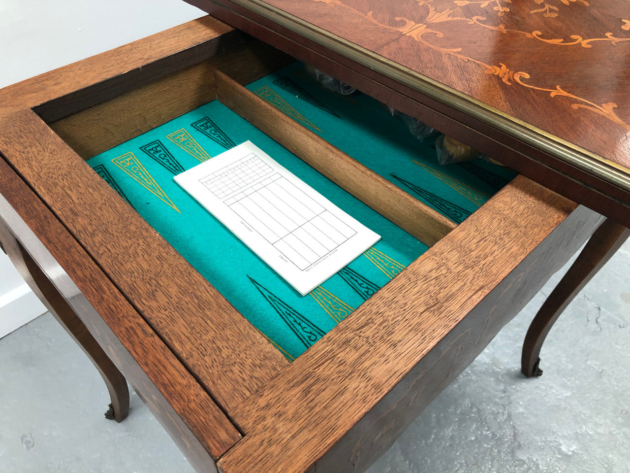 Beautiful french inlaid games table which includes internal drawers and bronze mounts. Internal drawers have counters and cards included.