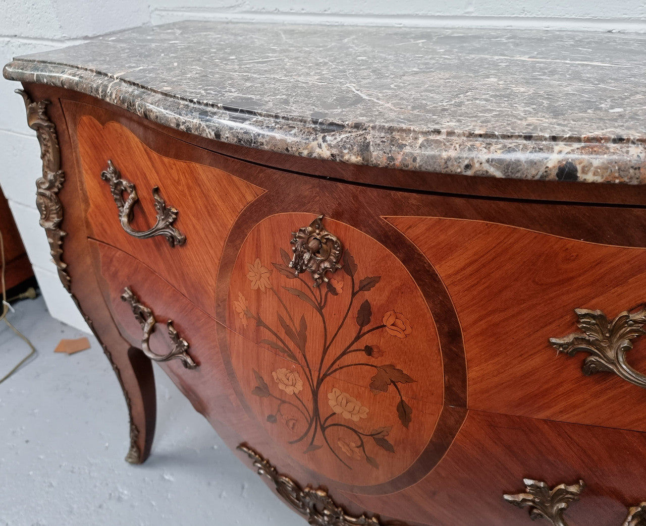 Beautiful French walnut Louis XV style two drawer commode. With a lovely floral marquetry inlaid design and marble top. It is in good original detailed condition.