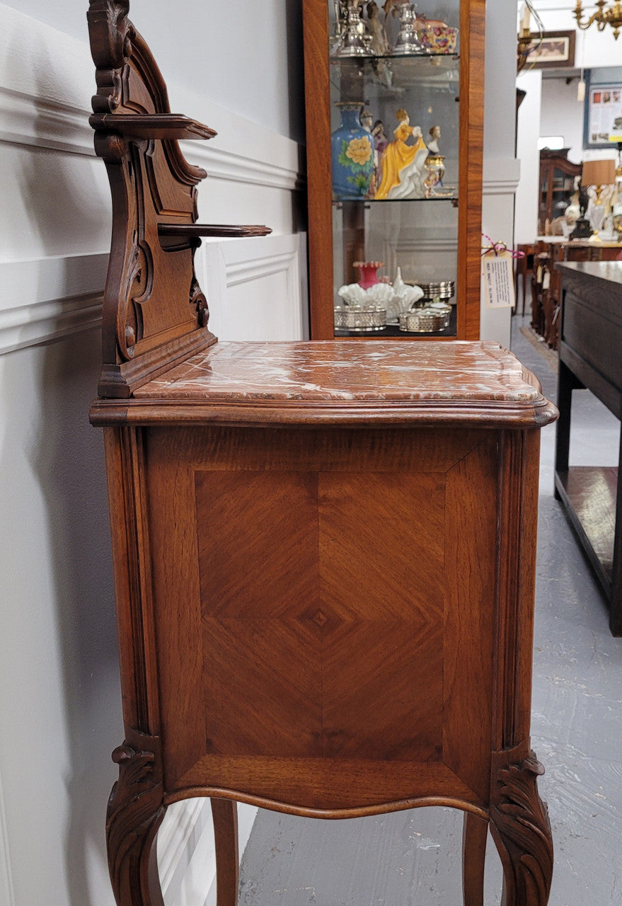 French Louis XV style Walnut single bedside cupboard with inset marble top. It has been sourced from France and is in good original detailed condition.