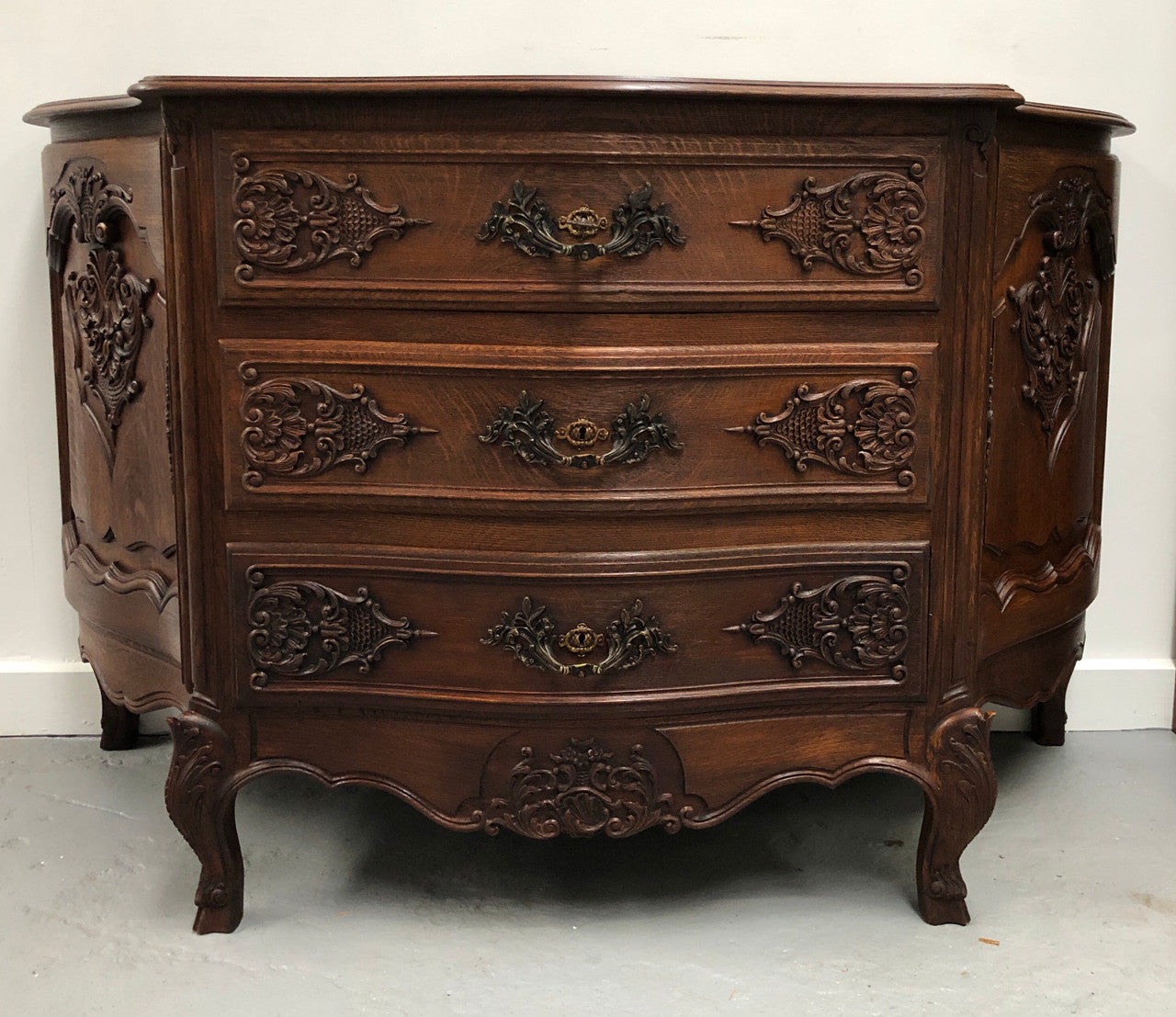 French Louis XV style dark Oak carved, two door and three drawer Commode /side cabinet. Could also be used as a TV cabinet or in the bedroom as storage very versatile. In good original detailed condition.