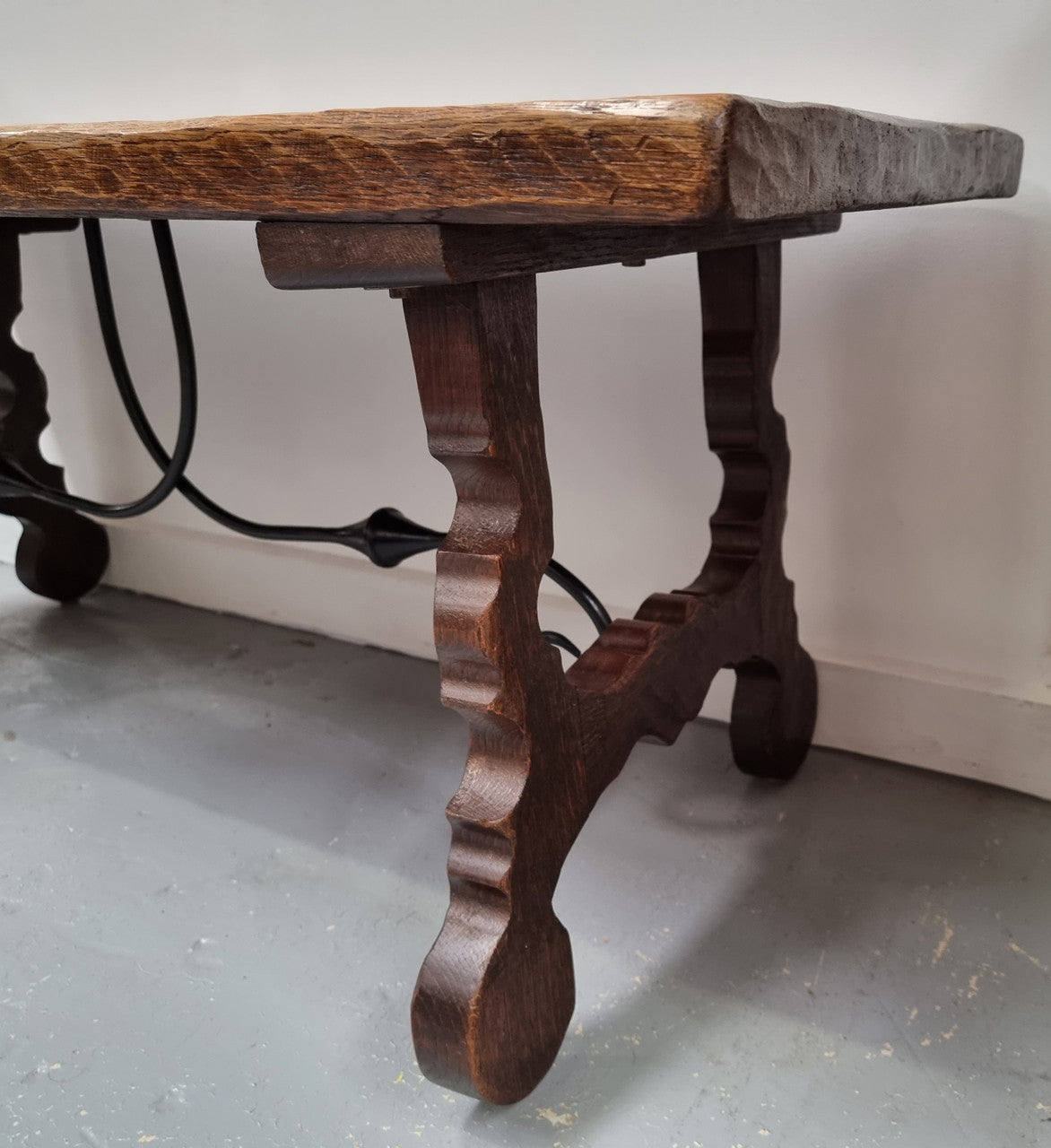 Charming French rustic Spanish style coffee table. It has an amazing rustic top and beautiful iron work. Sourced from France and is in good original detailed condition.