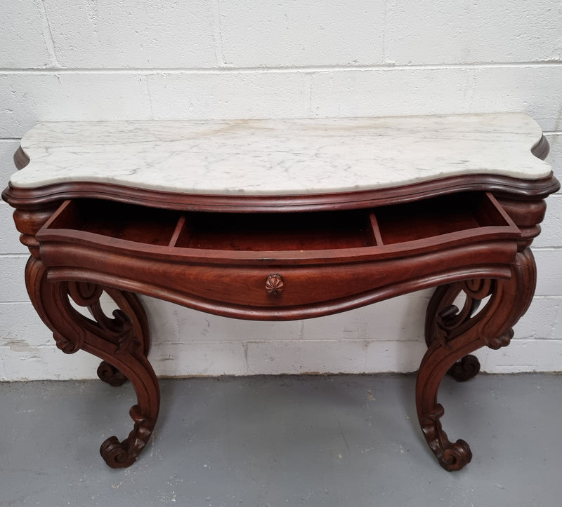 19th Century French Mahogany marble top console table. Louis XV style with white marble top and single drawer. Sourced from France and in good original detailed condition.