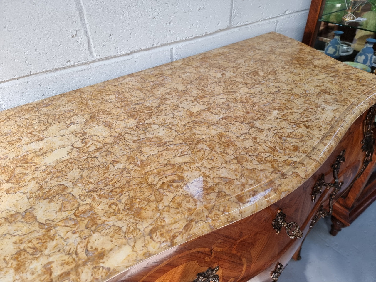 French marquetry inlaid Kingwood marble top commode. It has two drawers and beautiful mounts. Is in good original detailed condition.