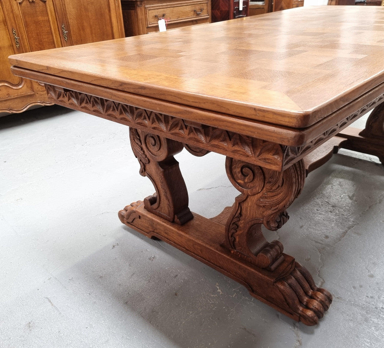Amazing French Oak Renaissance style parquetry top extension table. Beautiful parquetry top and amazing detailed carvings on the legs. It extends to 306 cm long when fully extended. Sourced from France and in good original detailed condition.
