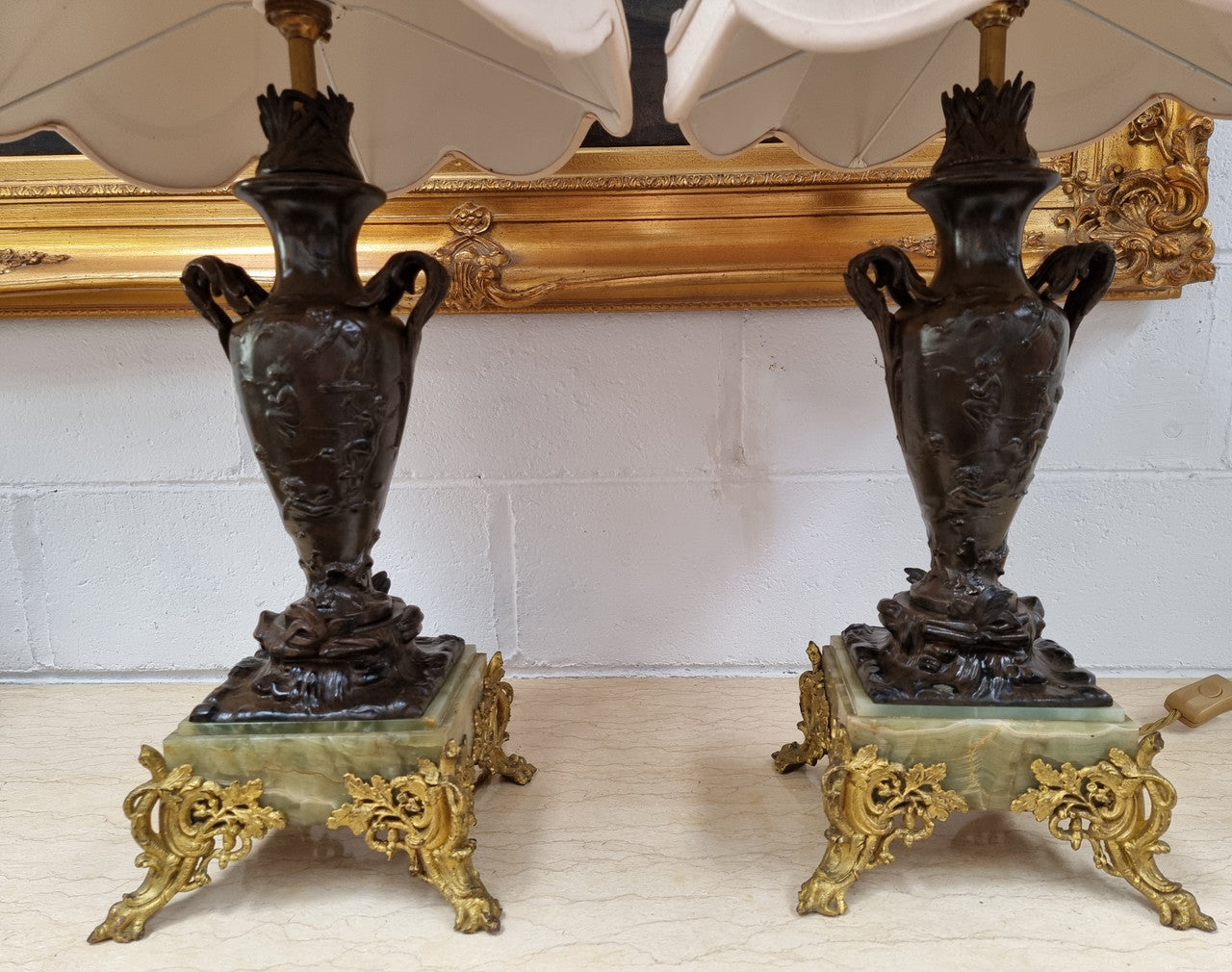 Pair of decorative Antique French gilt bronzed metal and marble table lamps. In good original detailed working condition.