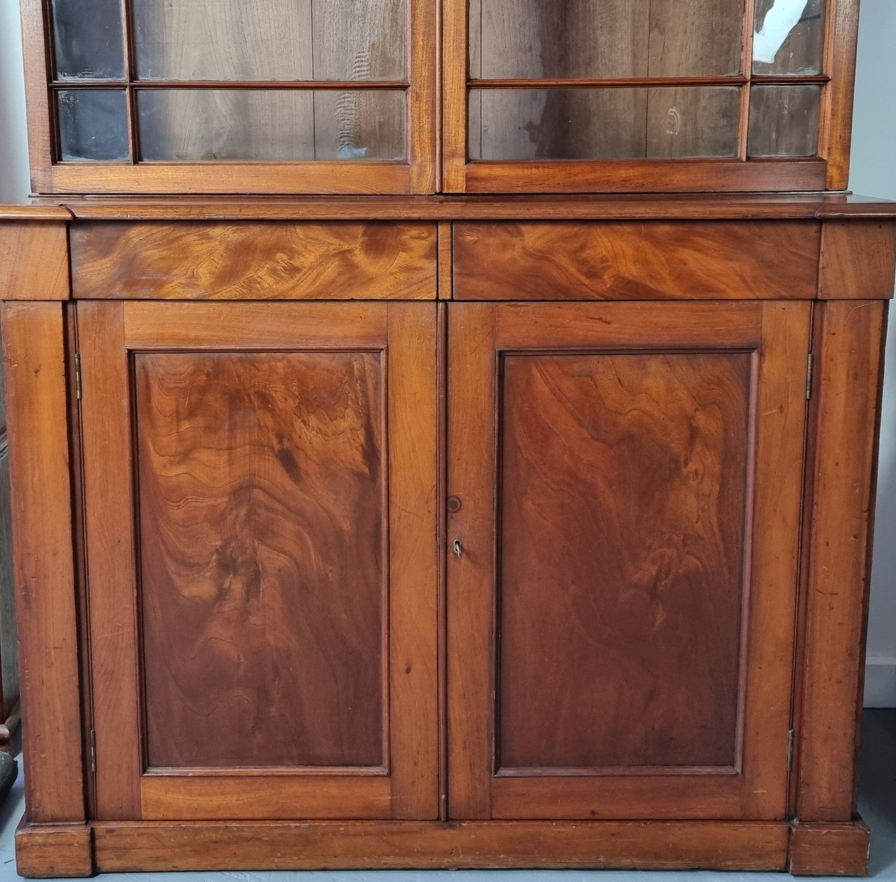 Rare early Australian colonial full Cedar bookcase. Plenty of storage underneath and glass top doors open up too three fully adjustable shelves. In good restored condition.