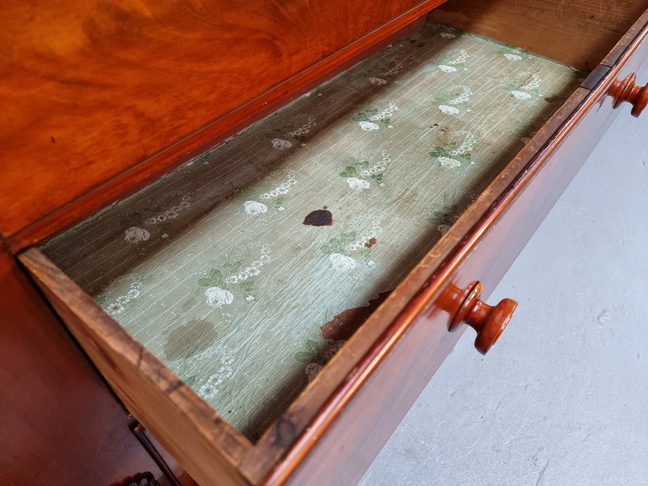 A 19th Century Scottish Flame Mahogany tall boy/ Chest of six drawers. Beautiful carvings and easily comes apart into three sections making transport o0r moving into place easy. In good original detailed condition.