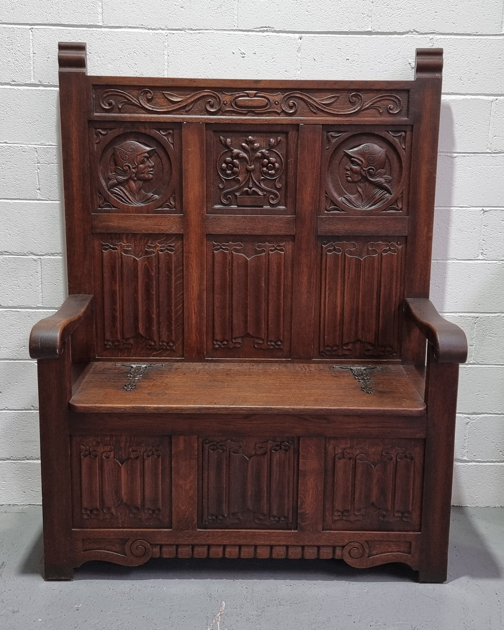 Decorative and nicely carved French Oak 19th Century hall seat with lift up lid for storage. Beautiful details and in good original detailed condition.