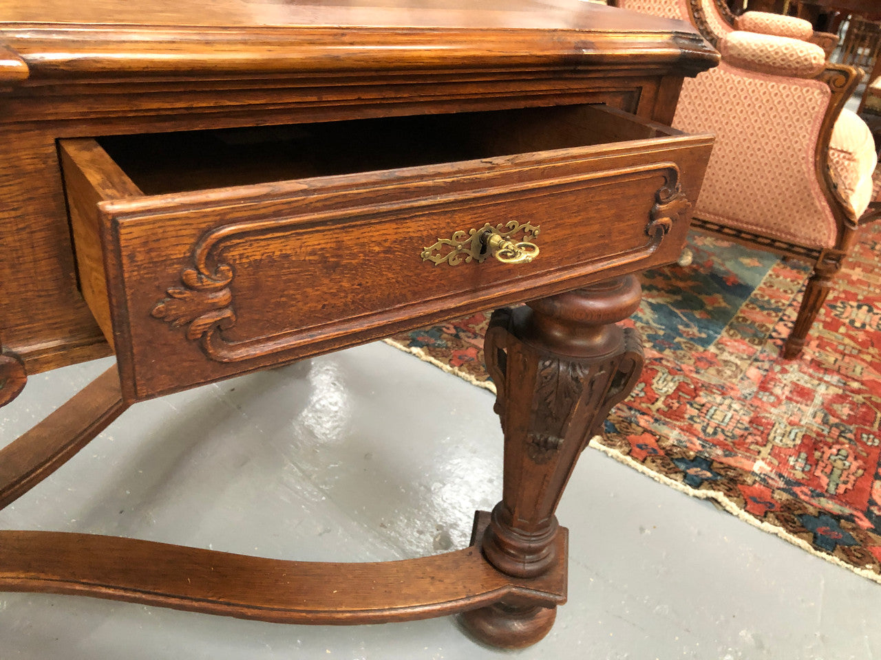 Beautifully carved 19th century French oak Bureau Plat. With a lovely parquetry top and two drawers and decorative carved legs this piece is definitely one to look at . In good original detailed condition.