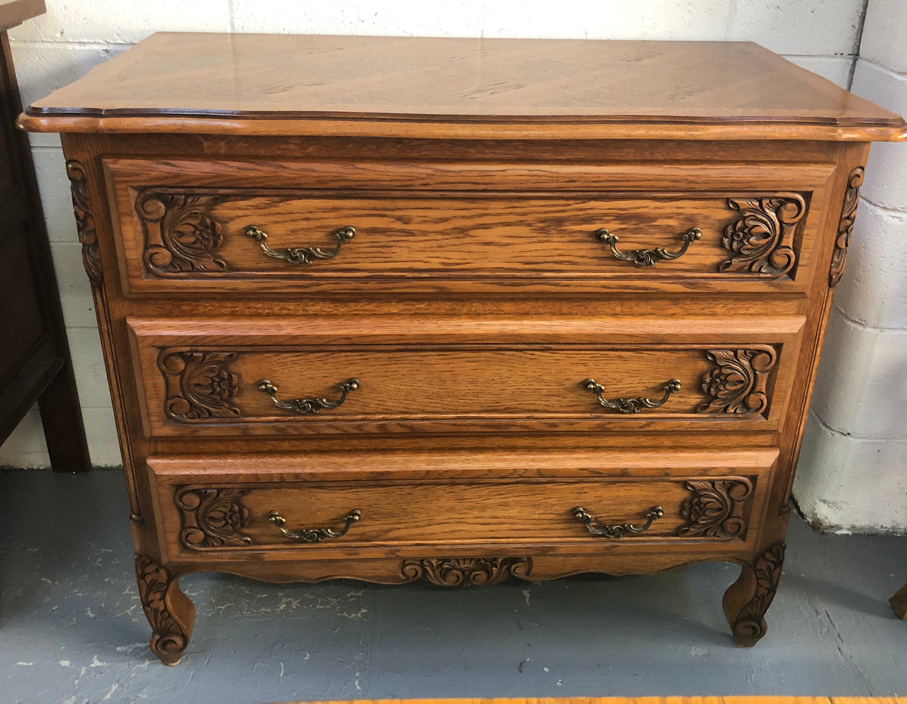 Gorgeous Provincial oak and parquetry top commode. It has beautiful carved Details and in good original detailed condition.
