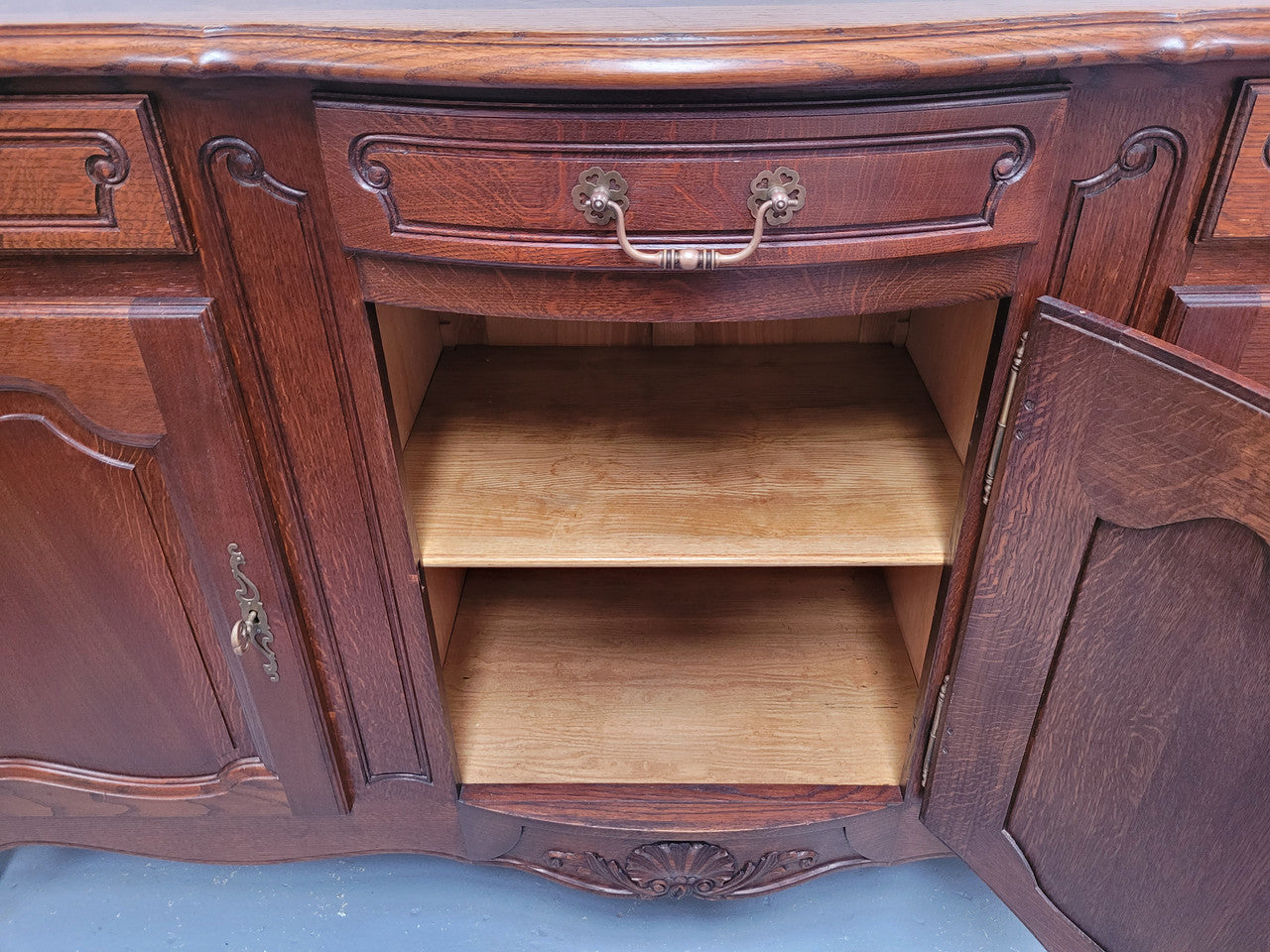 French Oak Louis XV style three drawer three door parquetry top sideboard. It has been sourced from France and is in good original detailed condition.