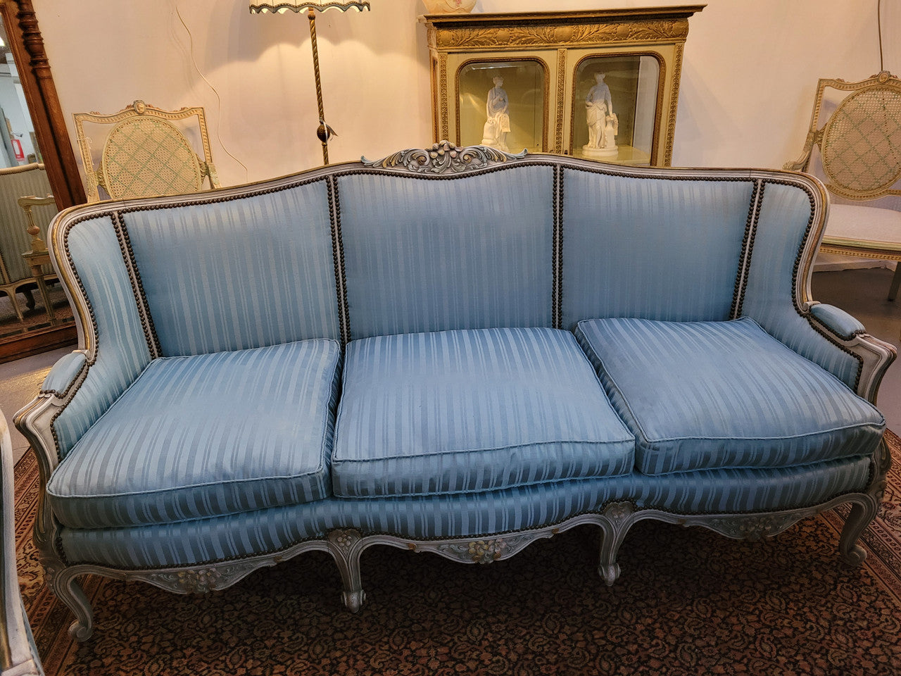 Well Proportioned Louis XV Salon Suite consisting of well proportioned 3 seater down cushioned, winged settee with 2 matching bergere chairs. All upholstered in stunning blue self stripe fabric. In excellent condition. Circa: 1930's.