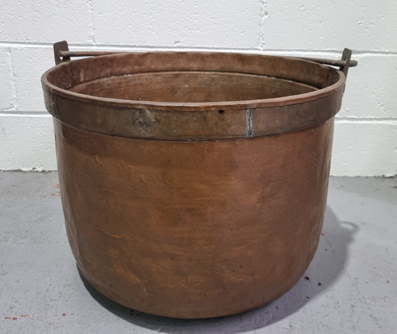 Large Antique French copper cauldron with metal band around rim. It is in good original condition.