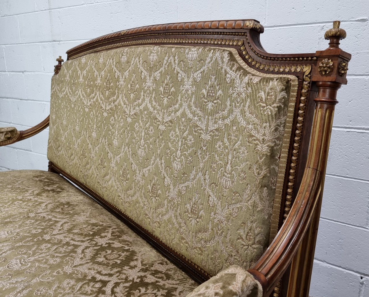 Beautiful French walnut Louis XVI style upholstered three piece Salon Suite. It has lovely fabric which is in overall good condition and is very comfortable to sit in. In good original detailed condition.
