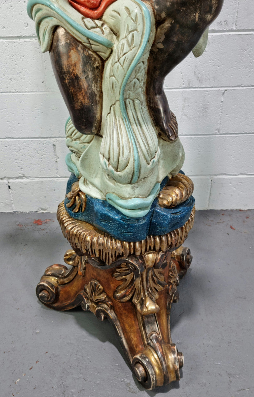 19th Century Italian Wooden Blackamoor lamp sourced in France. Made from carved wood painted & gilded. Amazing detail of a man playing a horn that then turns into a chandelier while riding a mythological sea serpent It has been fully rewired to Australian standards.