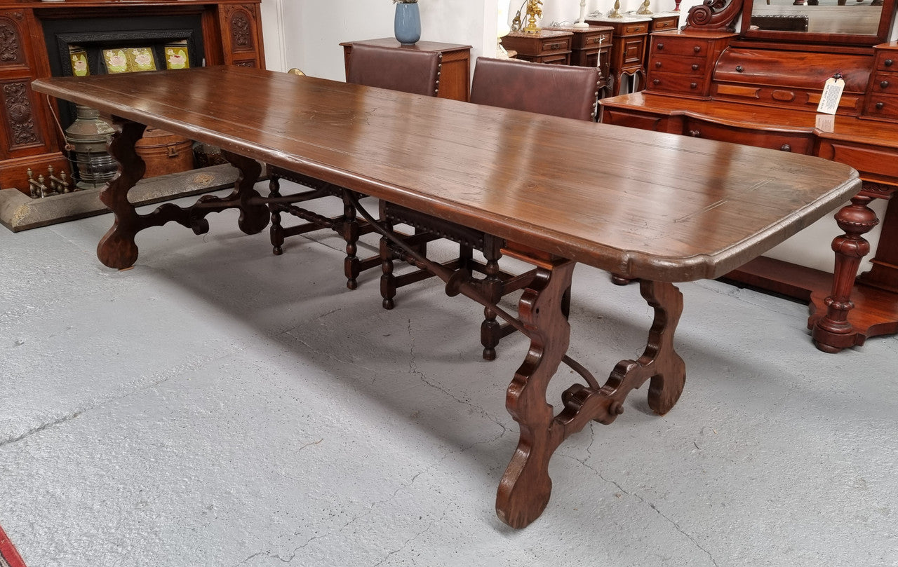 Amazing hard to find French Fruitwood Spanish style 3 meter dining table. Decorative iron work underneath and in good detailed original condition.