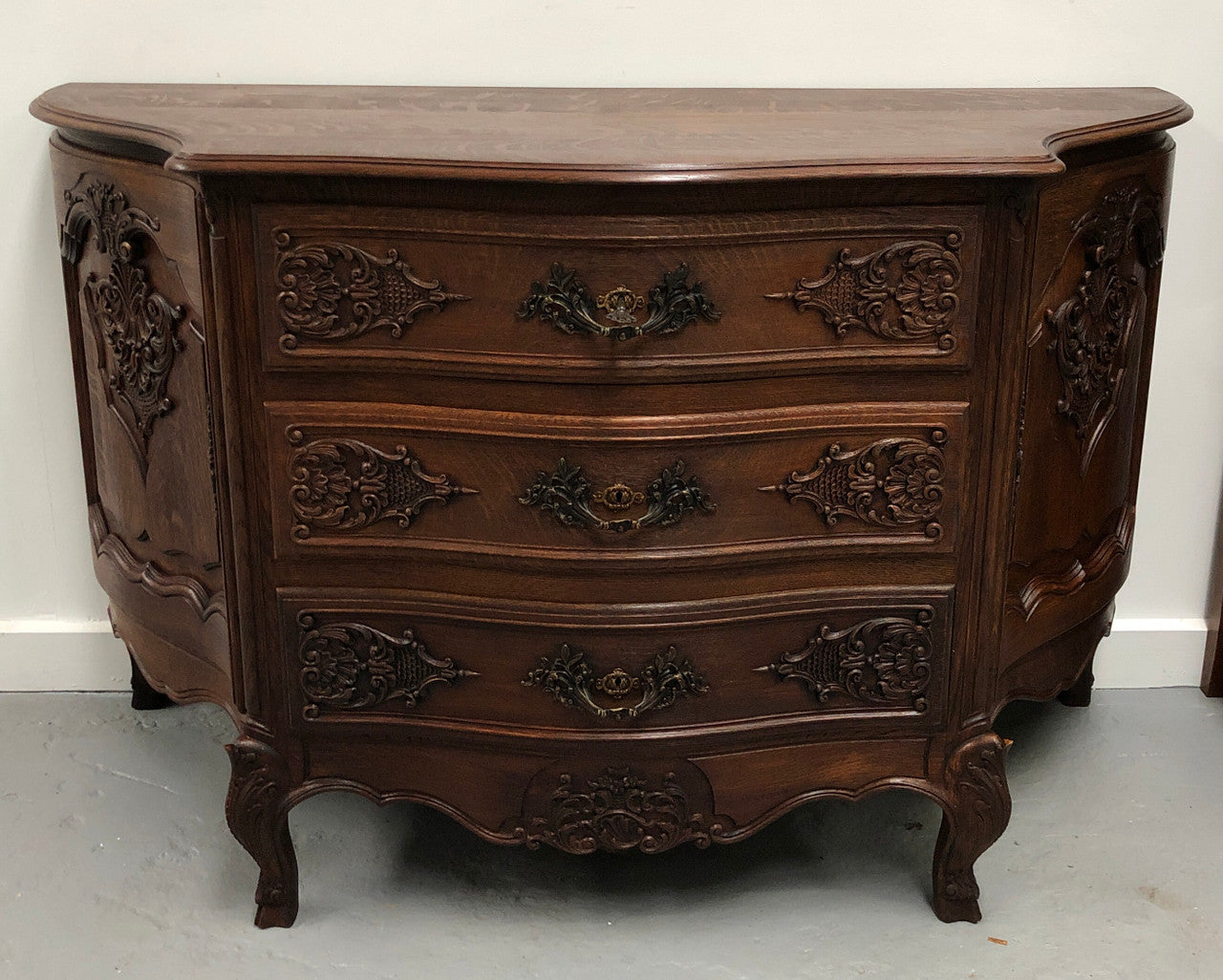 French Louis XV style dark Oak carved, two door and three drawer Commode /side cabinet. Could also be used as a TV cabinet or in the bedroom as storage very versatile. In good original detailed condition.
