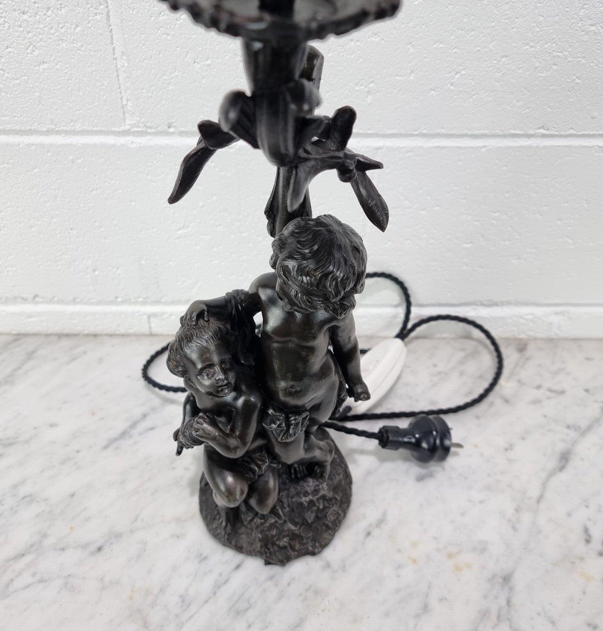 Antique French bronzed metal lamp with cherub's. in very good working original detailed condition.