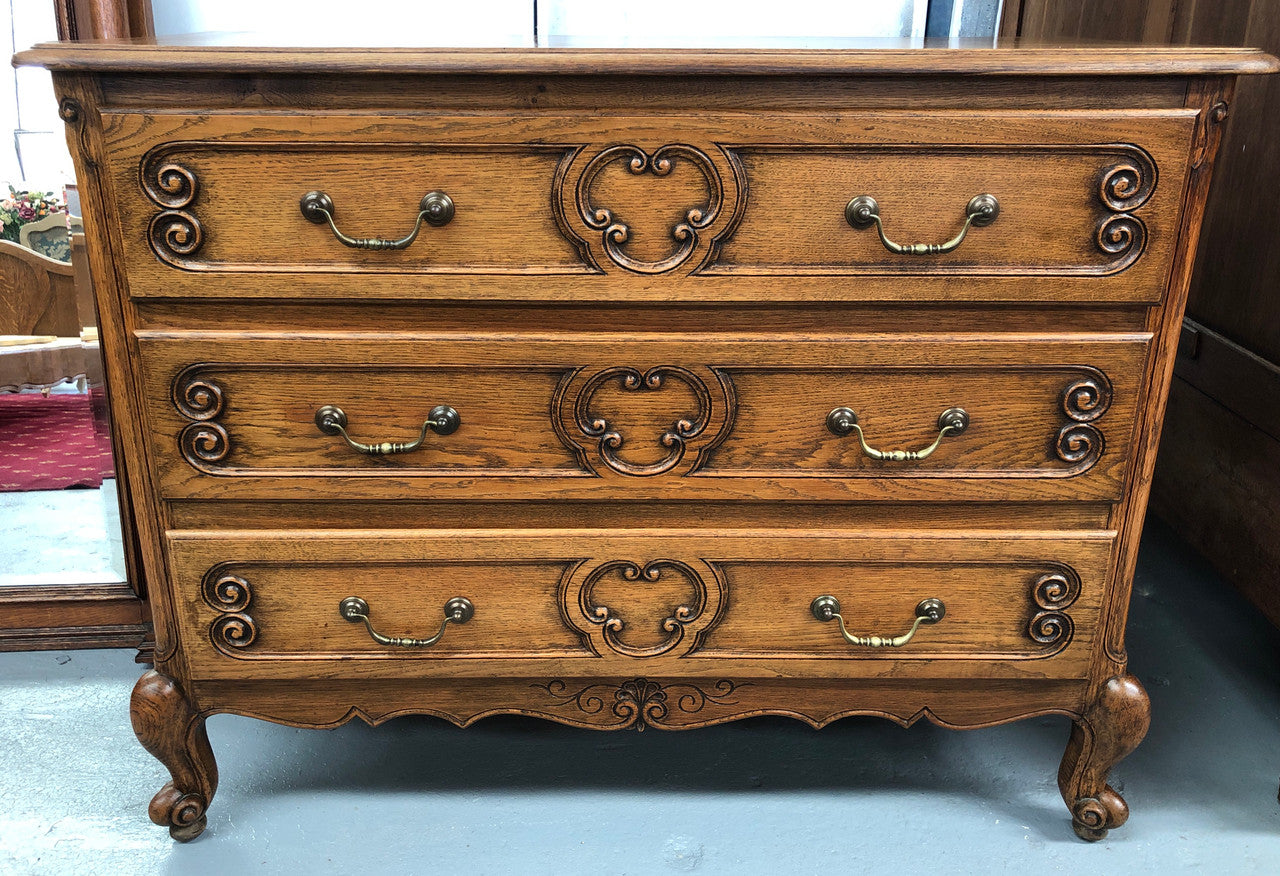 French nicely carved Oak chest of three drawers. In good original detailed condition.